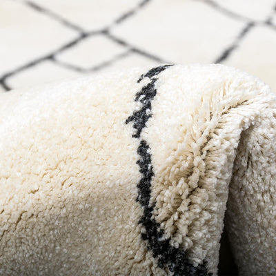 שטיח מרקש 06 קרם/שחור עם פרנזים | השטיח האדום